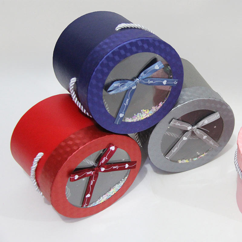 80101 Caja de regalo de dulces redonda transparente con ventana decorada con un lazo de cinta